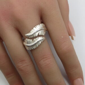 Silver crossover feather ring